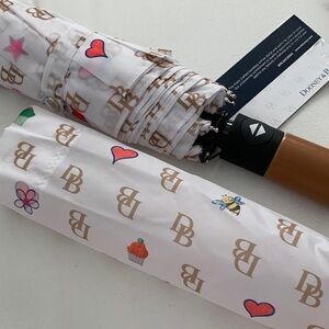 NWT - Dooney & Bourke White Patterned Umbrella with Leather Handle
